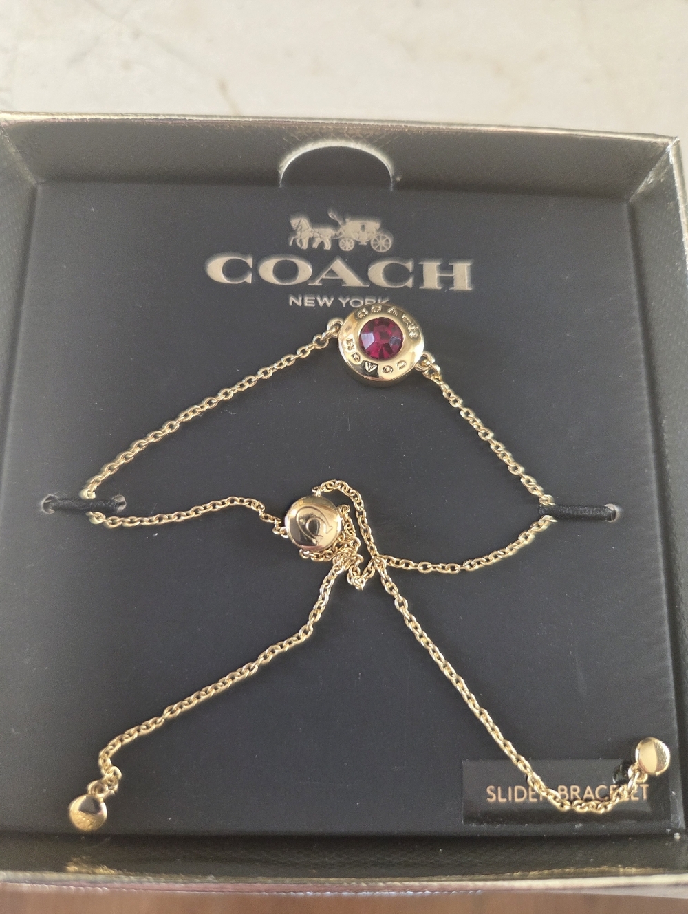 Coach Gold and Red Crystal Slider Bracelet